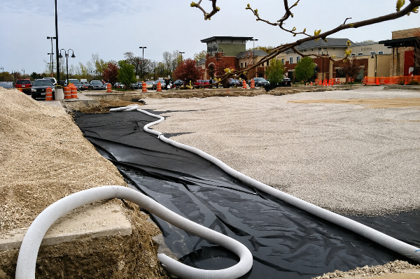 Stormwater management module installed under sports landscape and podium tanks